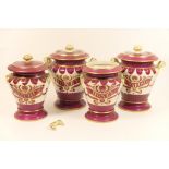 Four Staffordshire apothecary jars, circa 1840-60, comprising two shouldered covered jars,