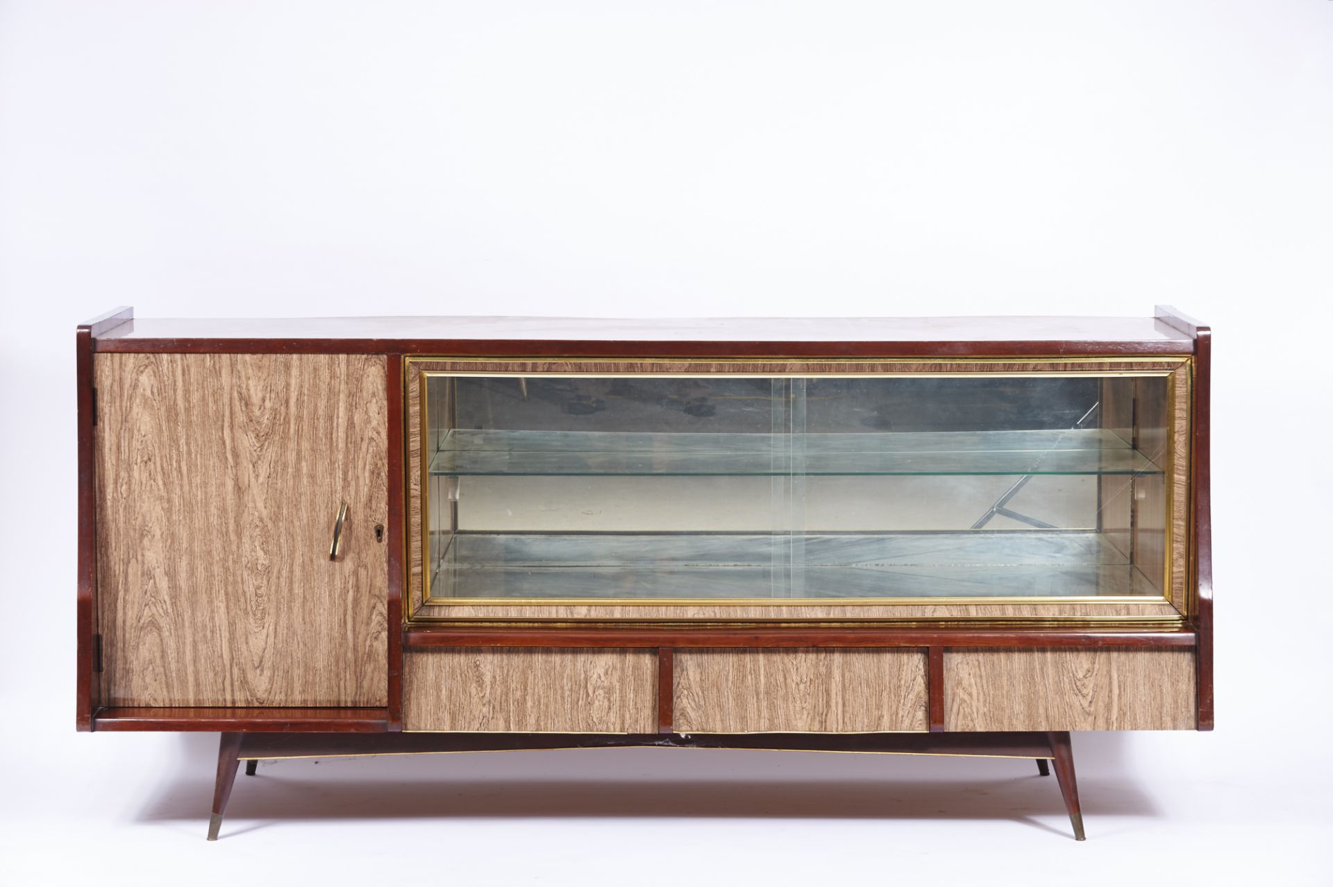 A Sideboard exotic wood formica top front and sides two glass sliding doors and shelves mirror