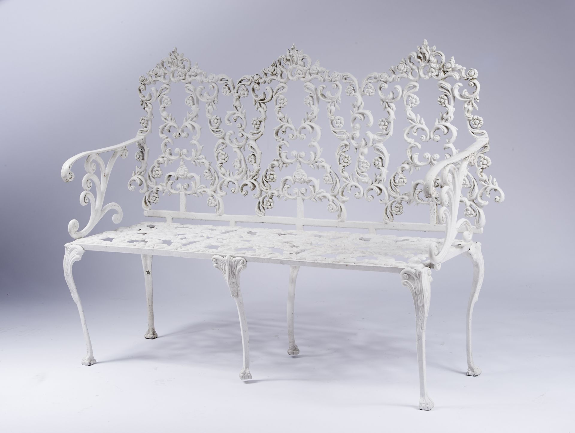A Garden Bench pierced and white painted iron en relief zoomorphic feet Portuguese 19th C. (2nd