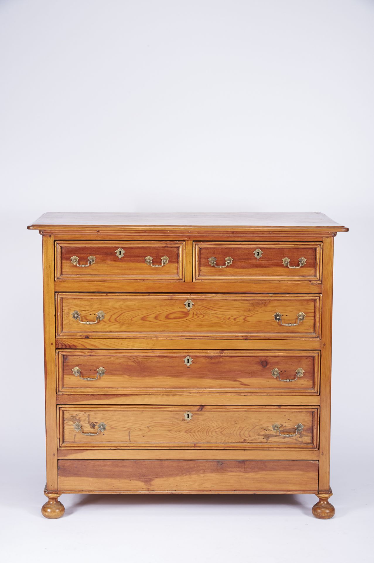 A Chest of Drawers Scots pine yellow metal mounts Portuguese 20th C. small restoration trcesof