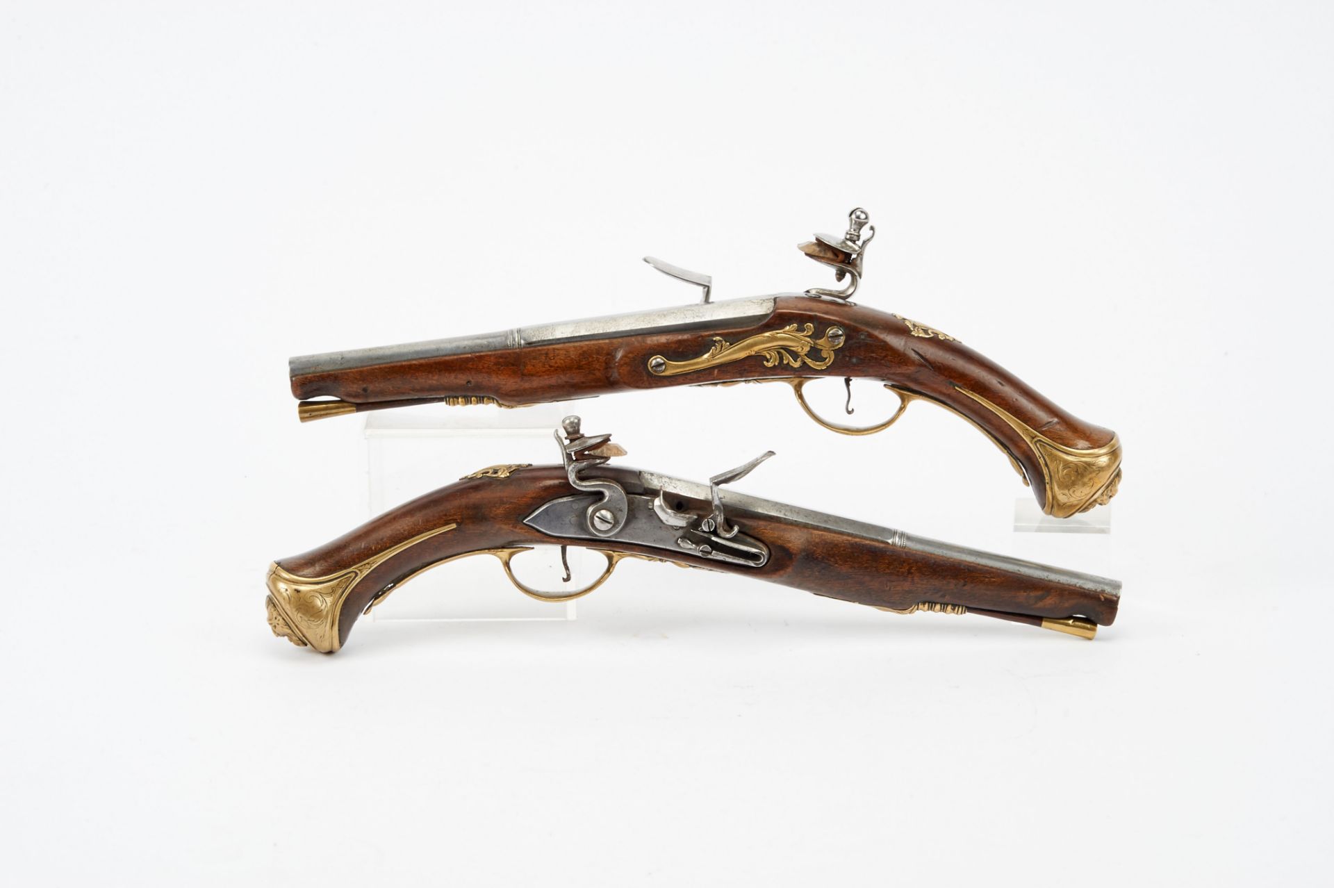 A Pair of Flintlock Pistols, wood, brass and iron, European, 18th/19th C., restoration, adaptations,