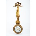 A Wall Clock, Louis XVI style, chiselled and gilt bronze en relief with strass chain and