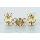 A Ring and a Pair of Earrings, 800/1000 gold, set with 12 1/2 pearls and 3 oval cut lemon quartz,