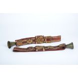 A Pair of Cattle Belts with Bells, leather and yellow metal applications "Cartouches", European,