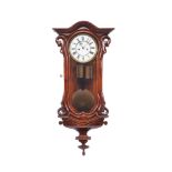 A «Viennese» Wall Clock, walnut case, eight-day autonomy, hour and half-hour gong chiming, two