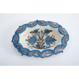 A Scalloped Platter, faience, blue and vinous lace-like decoration "Flowers", Portuguese, 17th C. (