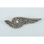 A Brooch "Wing", gold and silver, set with 1/2 pearls and 1 natural pearl (4.7mm), European, 19th/