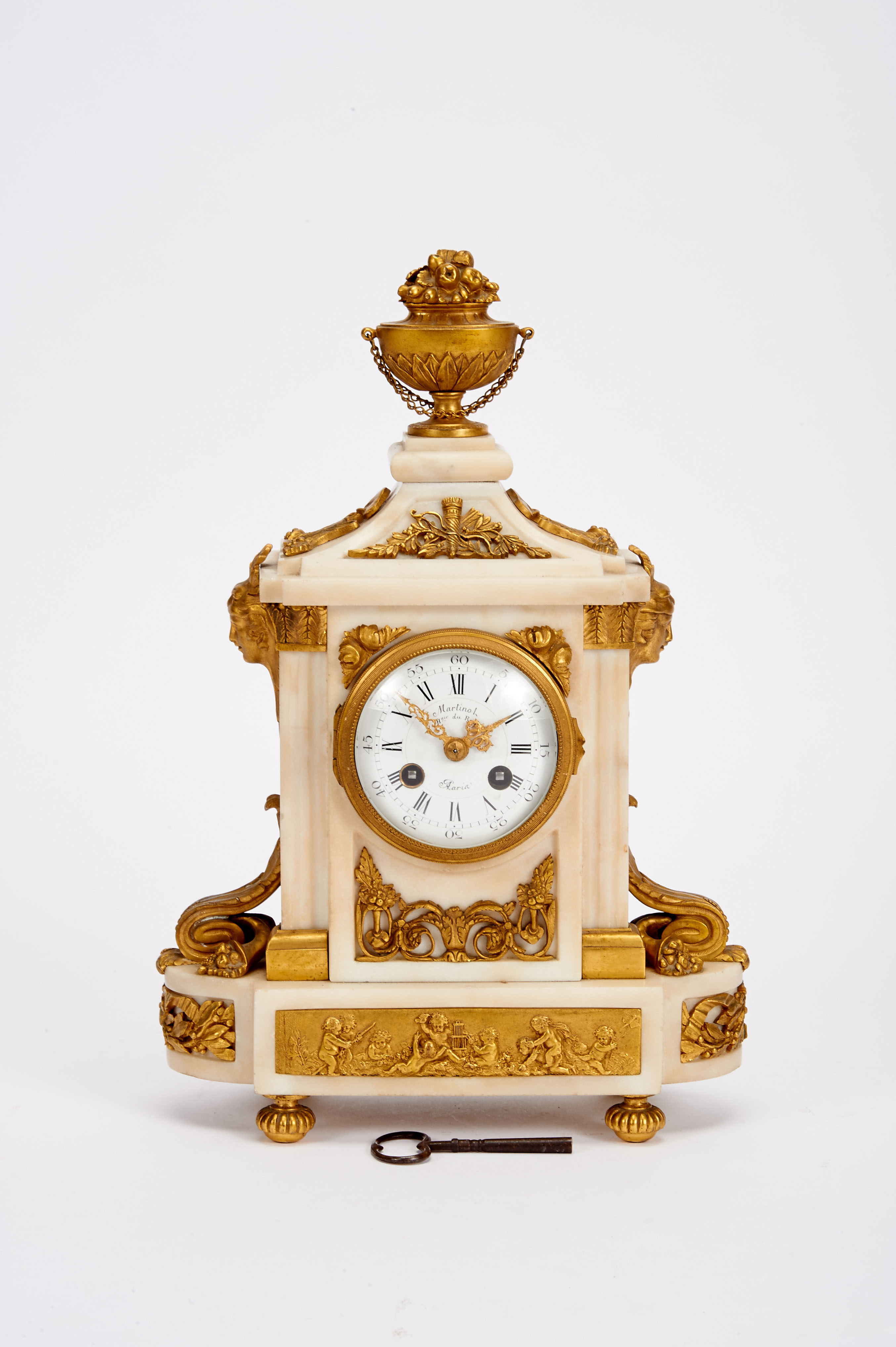 A Table Clock, Louis XVI style, white marble case with gilt, chiselled bronze mounts en relief "