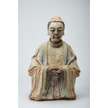 A Dignitary, part of terracotta sculpture with remains of paint, glass eyes, Chinese, 19th C.,