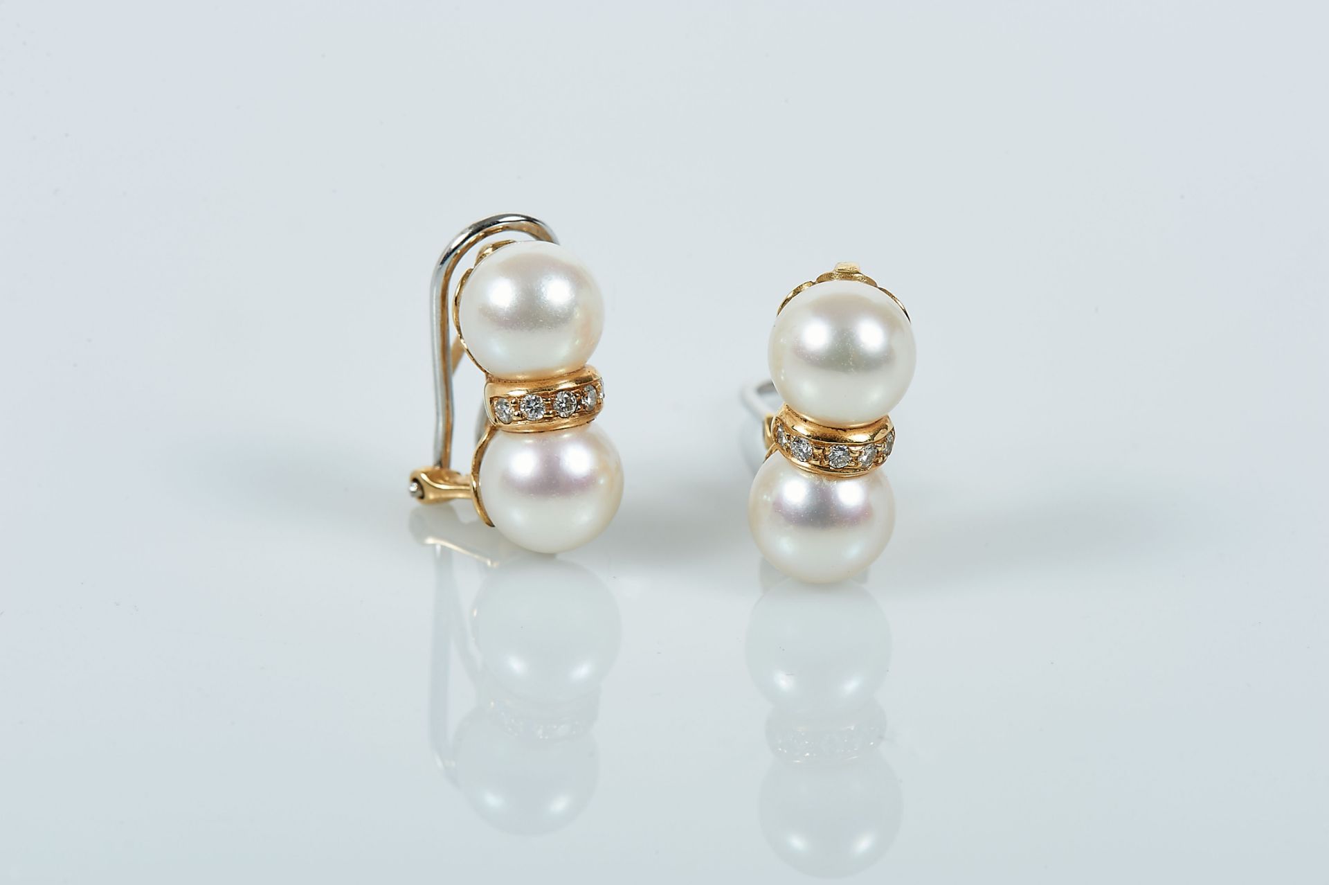 A Pair of Earrings, 800/1000 gold, set with 4 culture pearls (9mm) and 10 brilliant cut diamonds