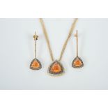 A Parure - Necklace and earrings, 800/1000 gold, centres set with 3 cabochon cut mandarin garnets