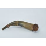 A Powder Flask, horn, carved wooden background with inscription "ANTONIO LUIS 1875", metal