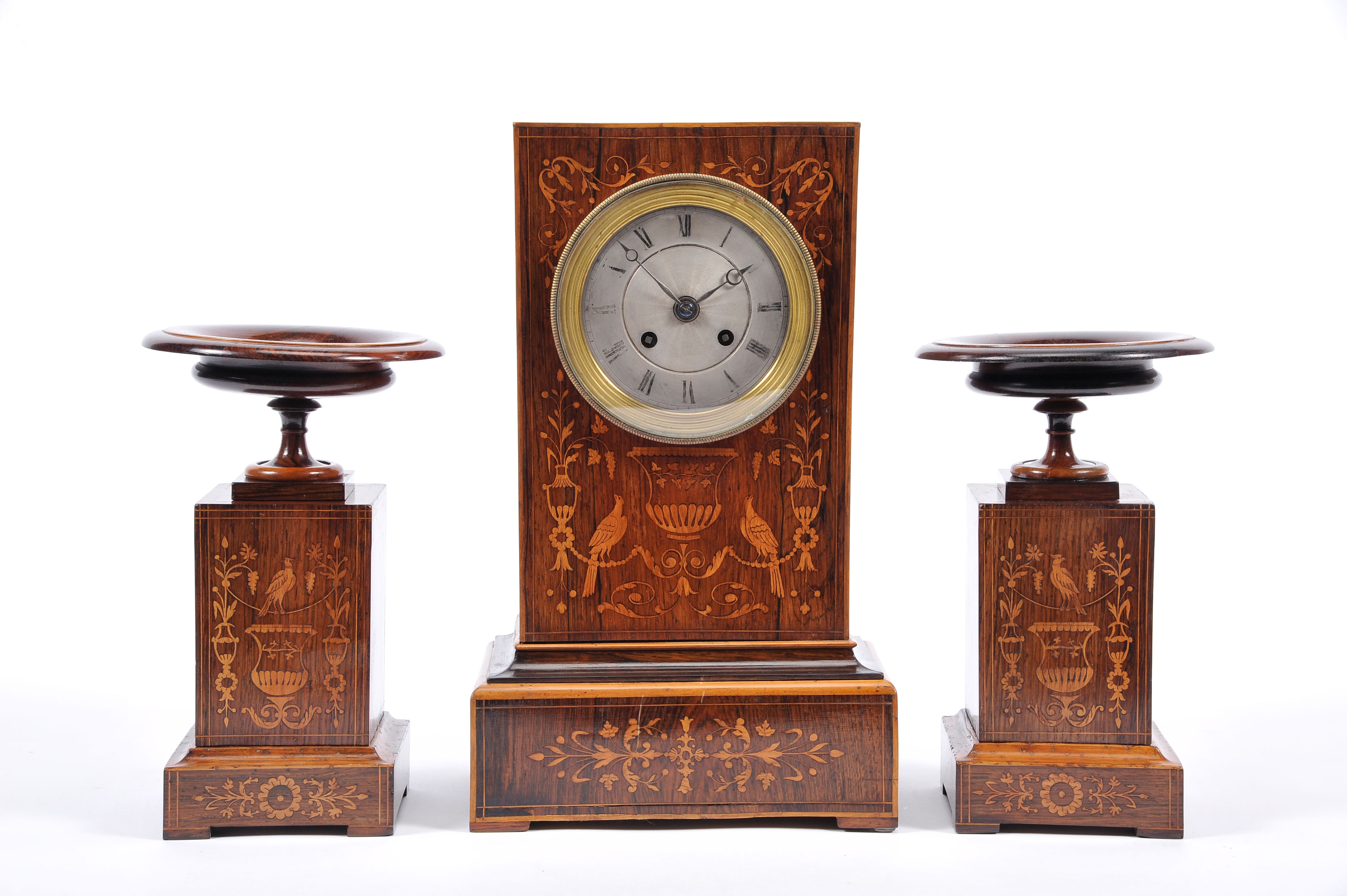 A Garniture - Table Clock and Pair of Cassolettes, Brazilian rosewood and satinwood marquetry "Birds