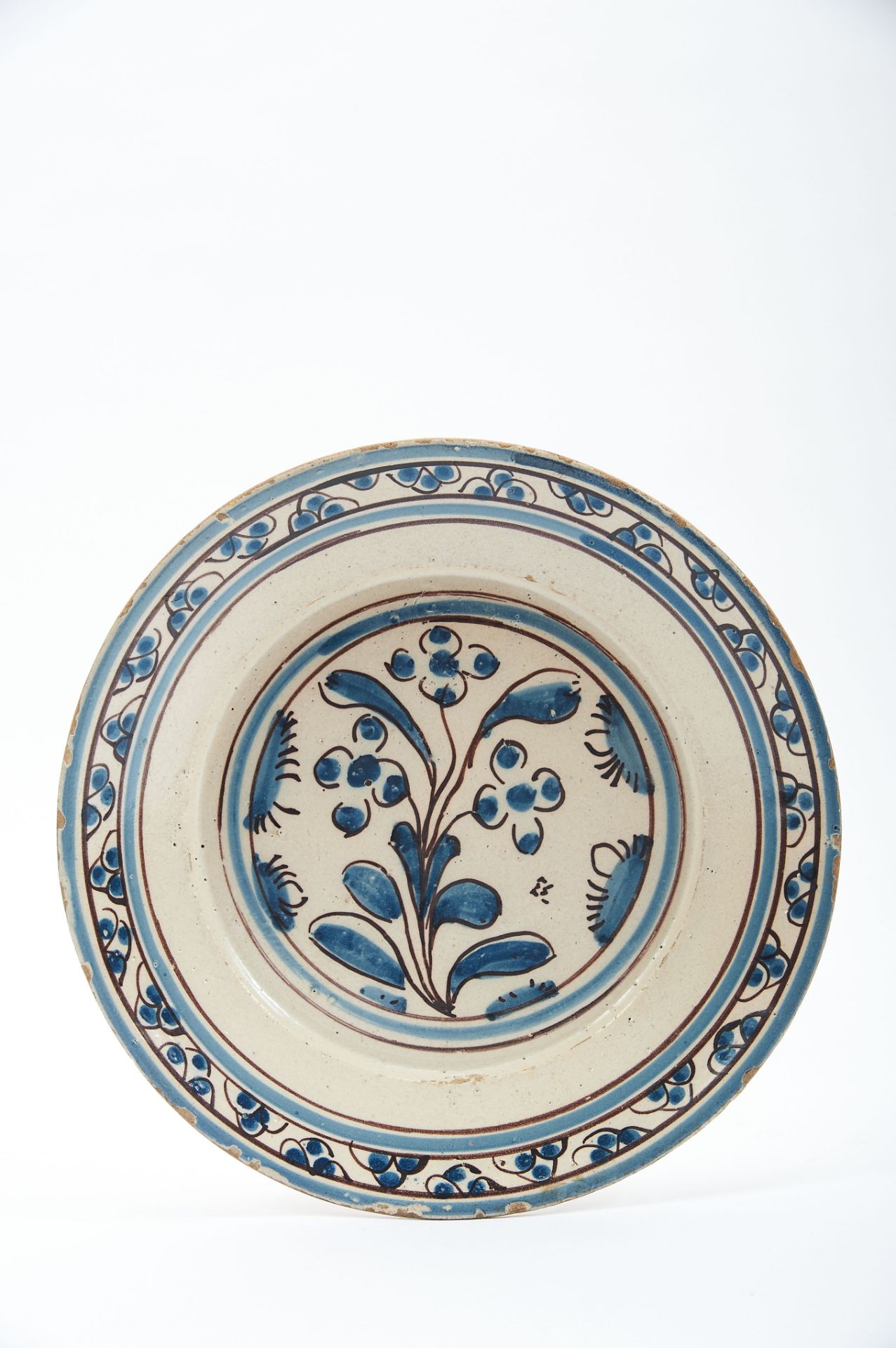 A Dish, faience, blue and vinous decoration known as "Contas", "Flowers", Portuguese, 17th C. (2nd