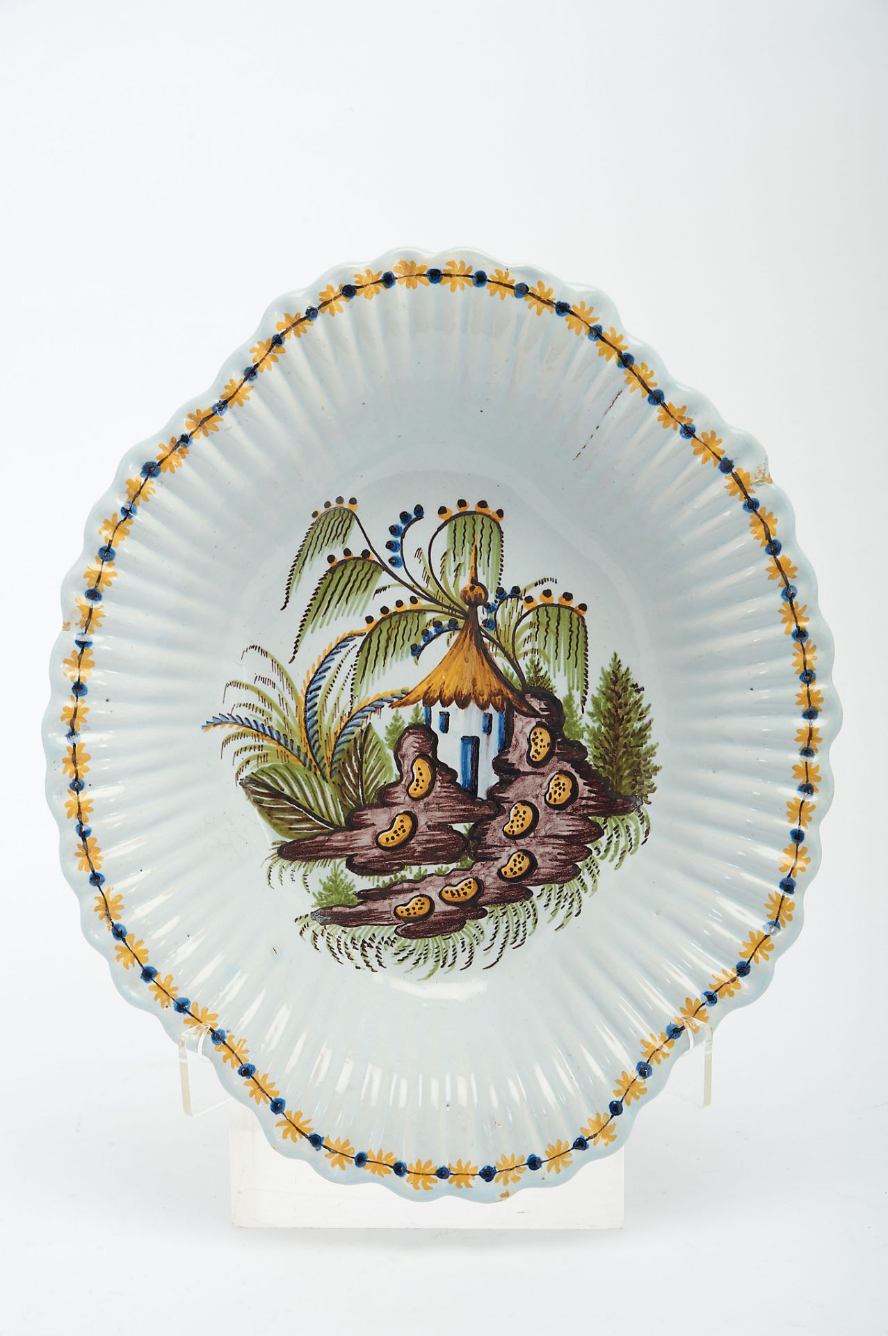 A Gadrooned Basin, faience possibly from Lisbon, polychrome decoration "Landscape with house",