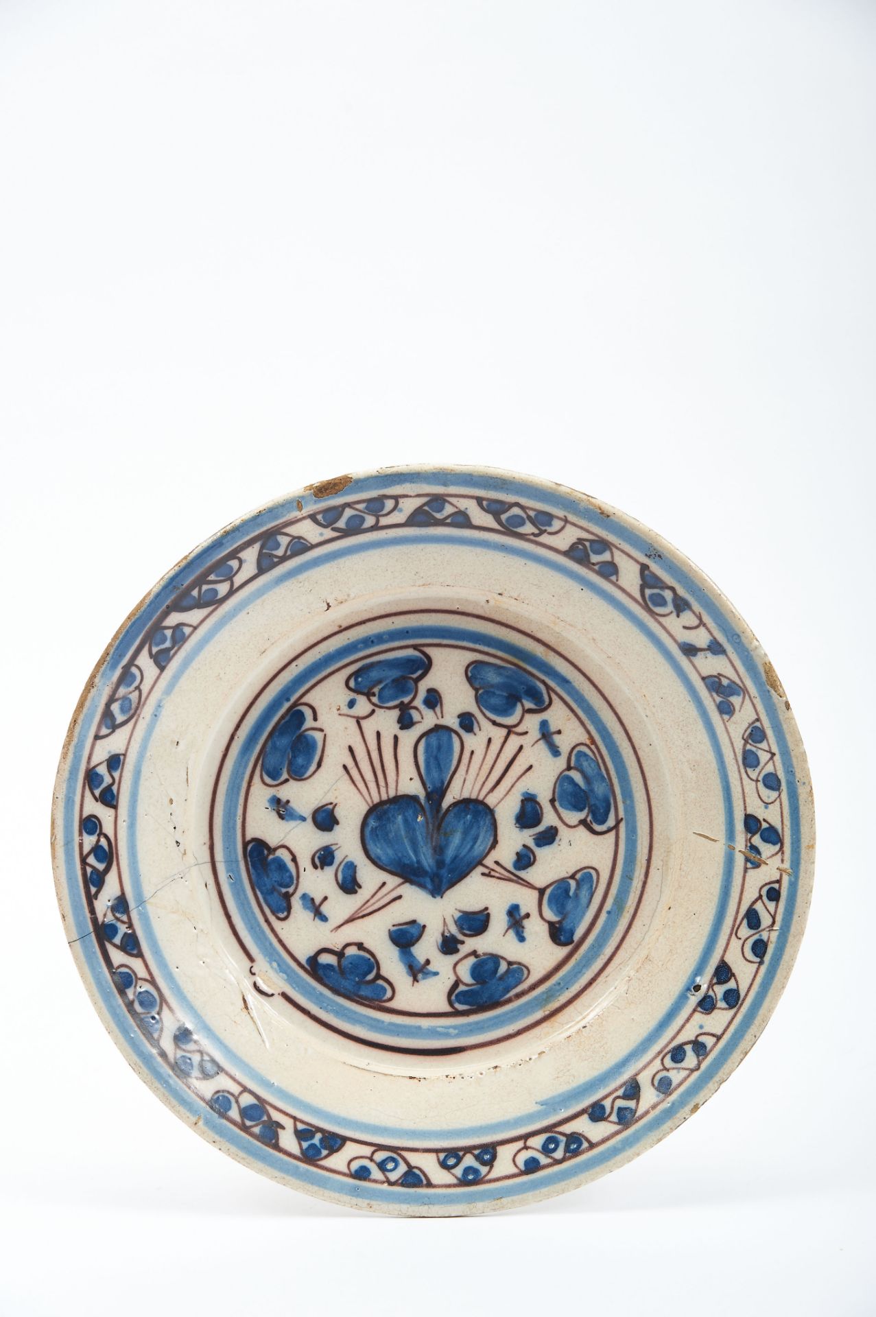 A Dish, faience, blue and vinous decoration known as "Contas", "Pierced Heart", Portuguese, 17th