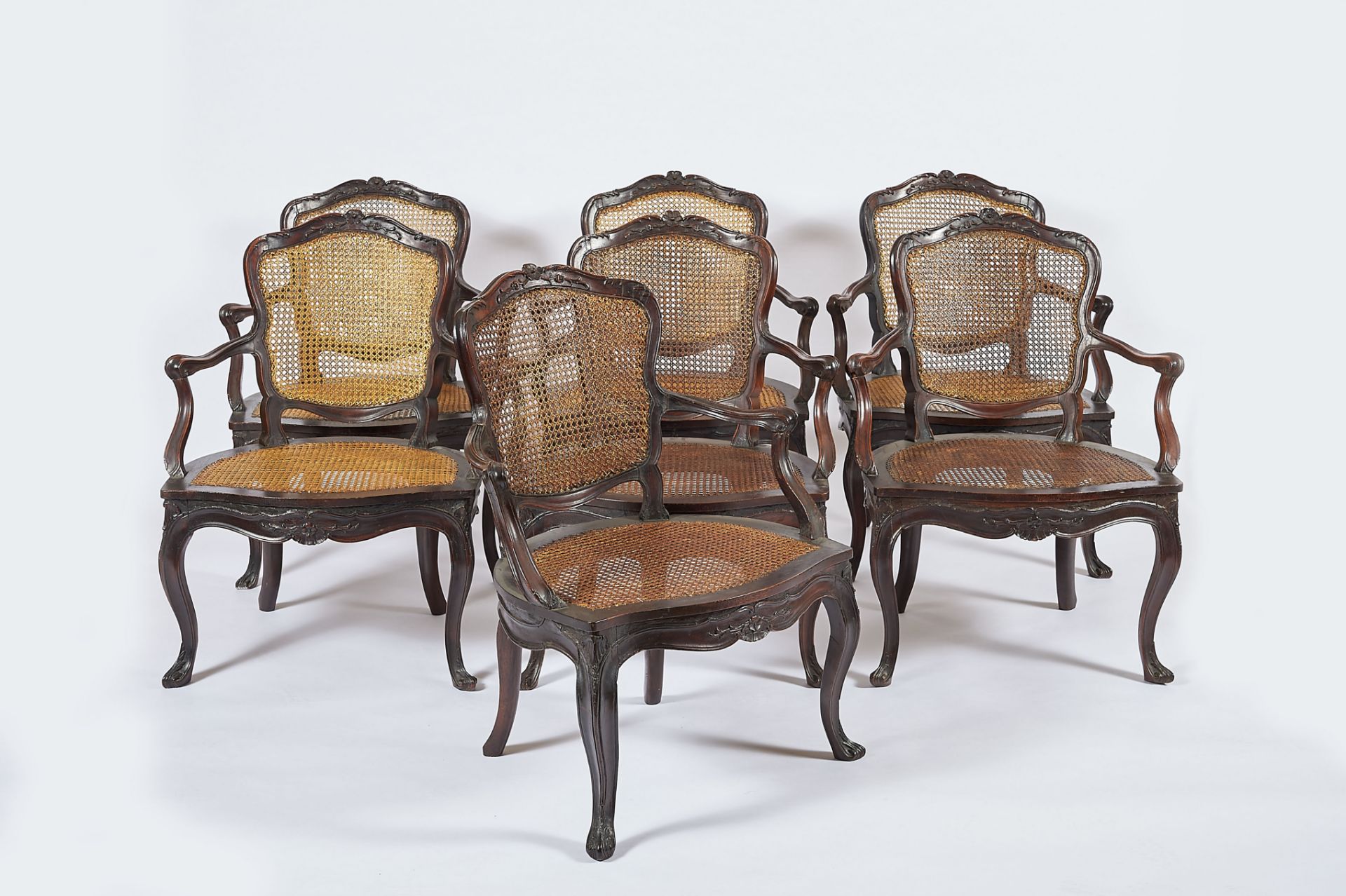 A Set of Seven Fauteuils, D. José I, King of Portugal (1750-1777), walnut, straw seats and backs,