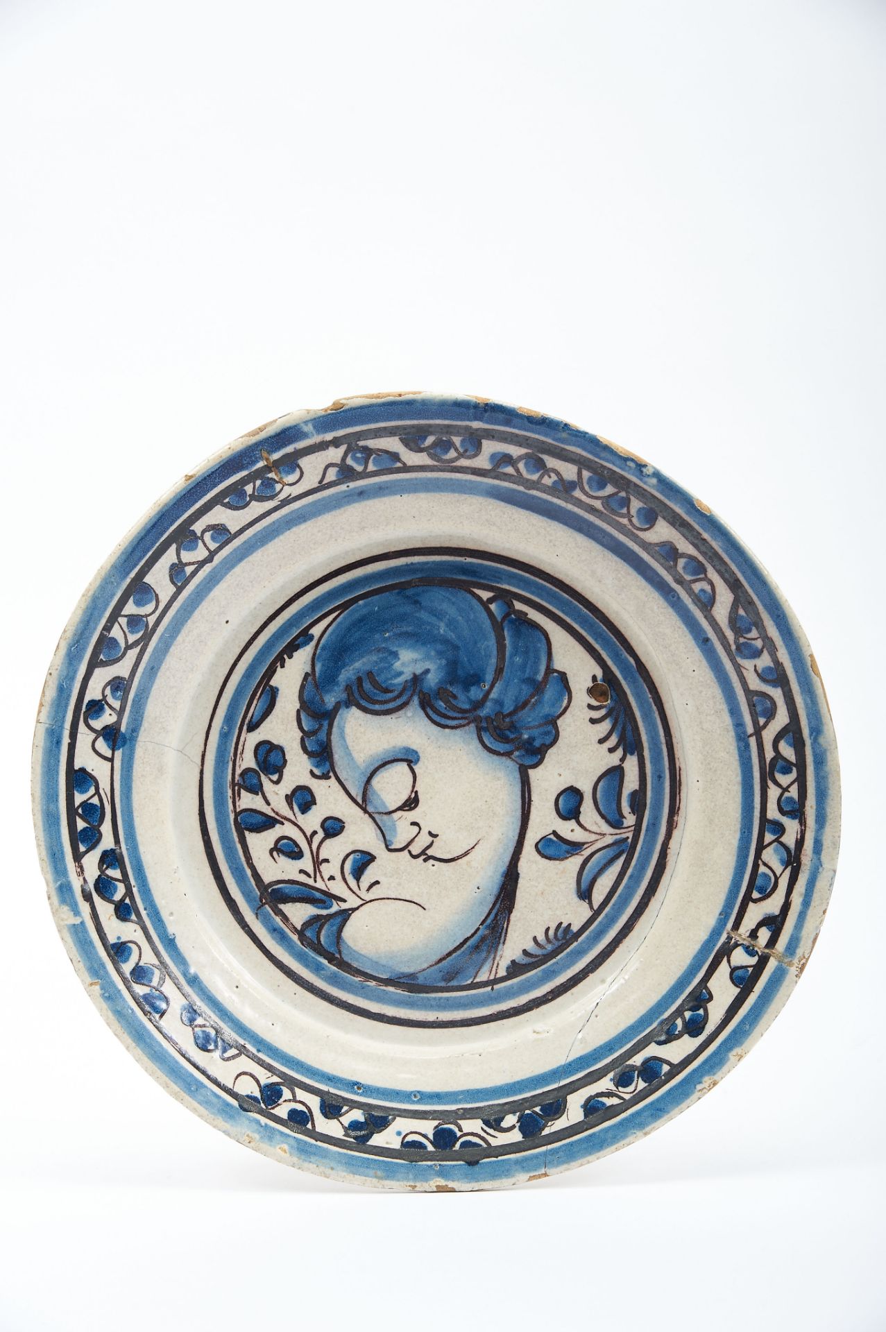 A Dish, faience, blue and vinous decoration known as "Contas", "Female bust", Portuguese, 17th C. (