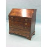 A George III mahogany bureau, fall-front enclosing an arrangement of drawers, pigeonholes and