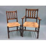A set of six dark oak dining chairs, including carver, with barley-twist backs and front stretchers,