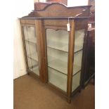 An Edwardian inlaid mahogany display cabinet, pair of glazed doors enclosing two fitted, lined