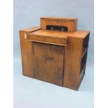 An unusual Art Deco oak-veneered writing desk, super-imposed stationery fittings include two glass