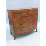 An early 19th century mahogany bow-fronted chest, cross-banded top above two short and three long