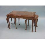A burr walnut nest of three tables, serpentine-shape on cabriole legs, 2ft. 8in.