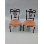 A pair of late Victorian mahogany drawing room single chairs, carved detail to splat-backs,