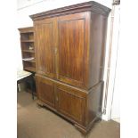 A Victorian mahogany linen press, pair of panelled doors enclosing two adjustable shelves, six