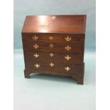 A George III mahogany bureau, fall-front enclosing eight pigeonholes and seven shallow drawers, four