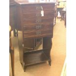 A late Victorian mahogany music chest, five fall-front drawers with embossed copper handles, open