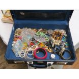 A quantity of costume jewellery, contained within Solingen blue vinyl case