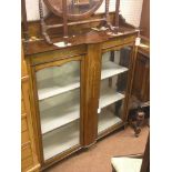 An Edwardian inlaid mahogany display cabinet, pair of glazed doors enclosing two fitted, lined