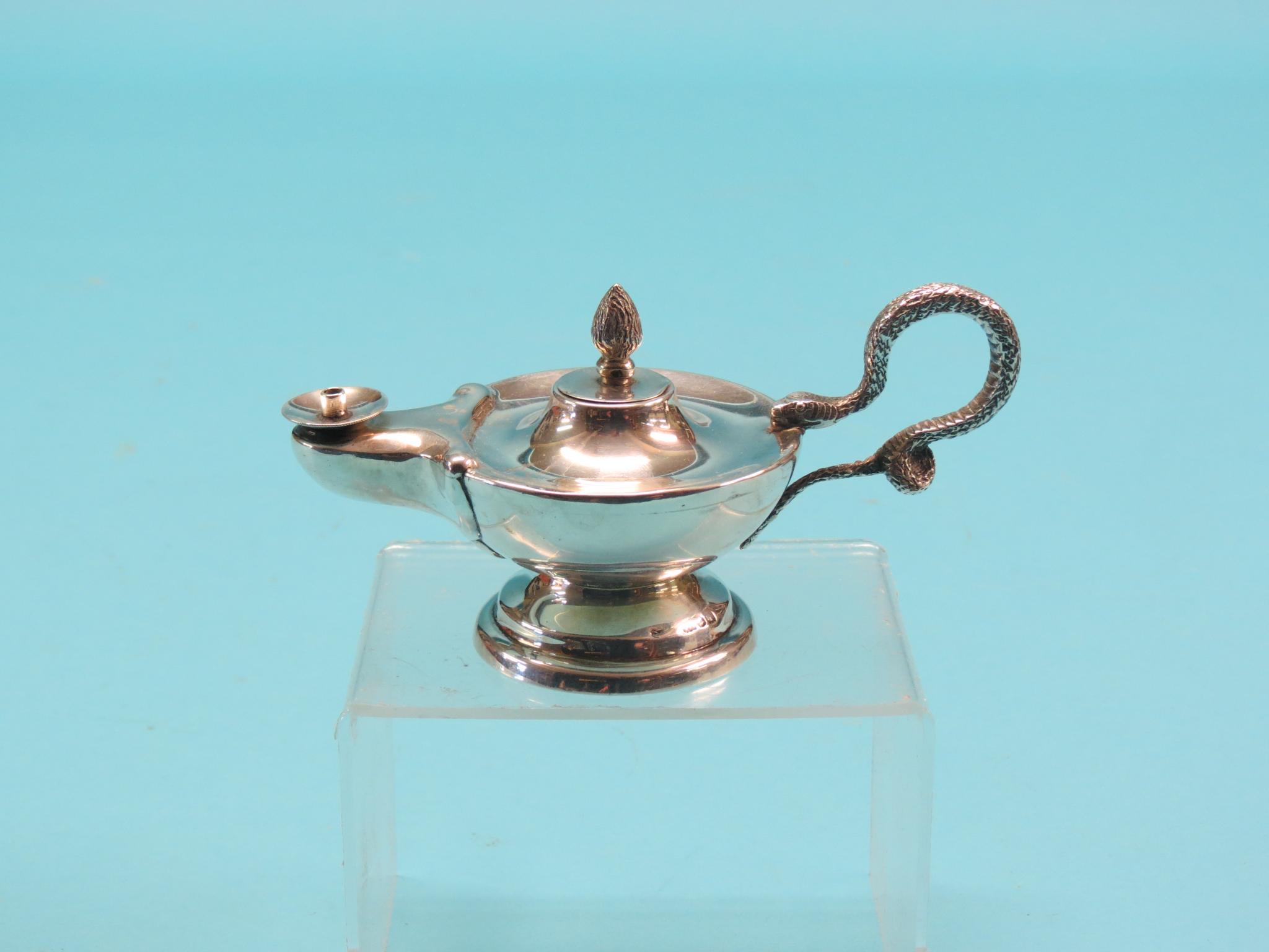 A novelty silver club lighter, in the form of an ancient oil lamp with serpent handle,