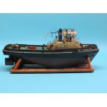 A radio-controlled model tug, Smit Nederland, black hull, brown beneath the waterline, twin-screw