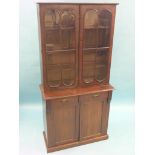 A Victorian mahogany bookcase, upper stage with a pair of astragal-glazed doors enclosing three