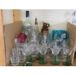 An assortment of drinking glassware, clear and coloured