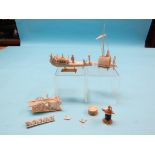 A group of three early 20th century Indian ivory carvings, two boat models and two-wheeled cart, and