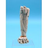 A Japanese ivory figure, Meiji period, female carrying basket of fruit, on scroll base, unsigned,