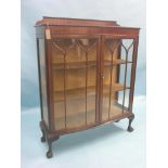 An early 20th century mahogany display cabinet, lined interior with two fitted shelves enclosed by