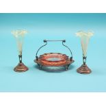 A coloured glass sweetmeat dish, on silver plated stand with swing handle, 5in. high, and a pair