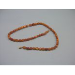 An amber bead necklace, 52.6 grams; 30in. long