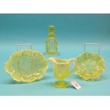 Pressed lime-green glass tableware, two dishes, bottle with stopper and jug