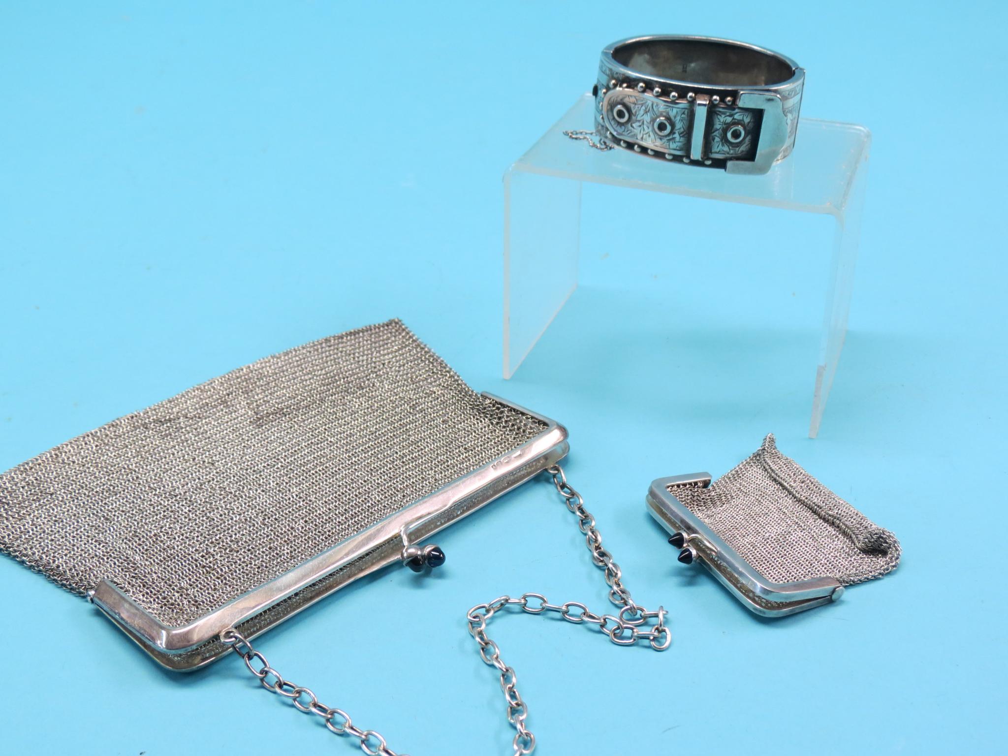 A silver mesh evening purse, with blue stone acorn clips, and a near-matching miniature silver