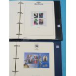 Two stamp collections, The Queen's Golden Jubilee, and The Millennium, each in album