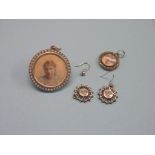 An early 20th century white metal locket, with seed-pearl circumference, twin inset portrait