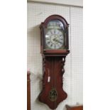 An early 19th century Dutch 30-hour wall clock, 10.5in. re-painted arched dial in oak case, with