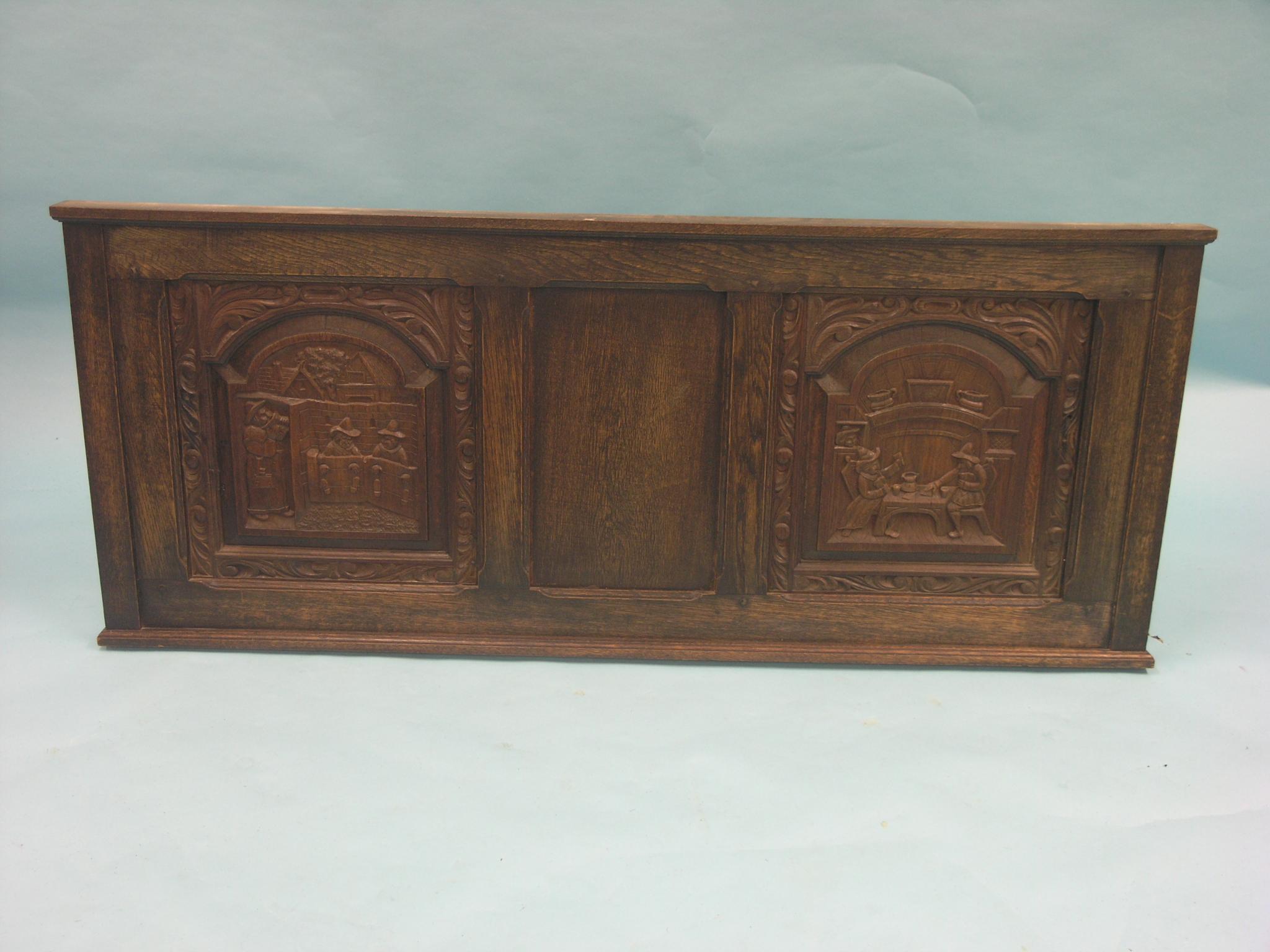 Two large oak Flemish panellings, all panels carved with figures at various pursuits, 4ft. 10in.