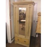 A late Victorian stripped beech wardrobe, panelled front with mirror door, single pine drawer